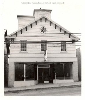 Black and white image of streetside front of Main St Center