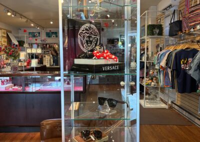 Interior of current business showing a display case with sunglasses