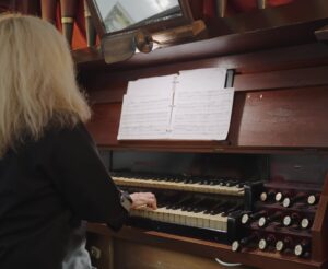 organist with hands on keys